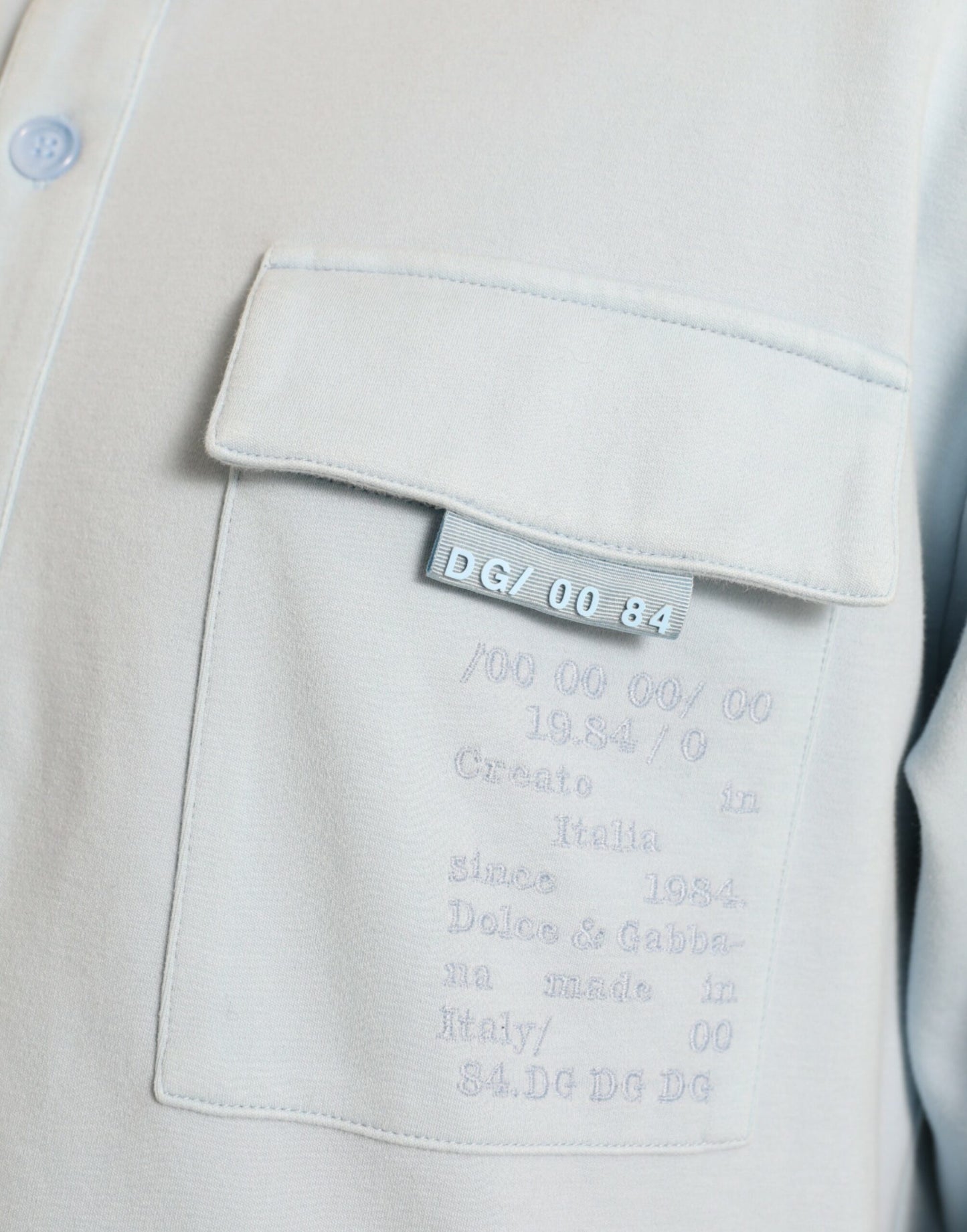 Dolce & Gabbana Hellblauer Pullover aus Baumwolle mit Knöpfen